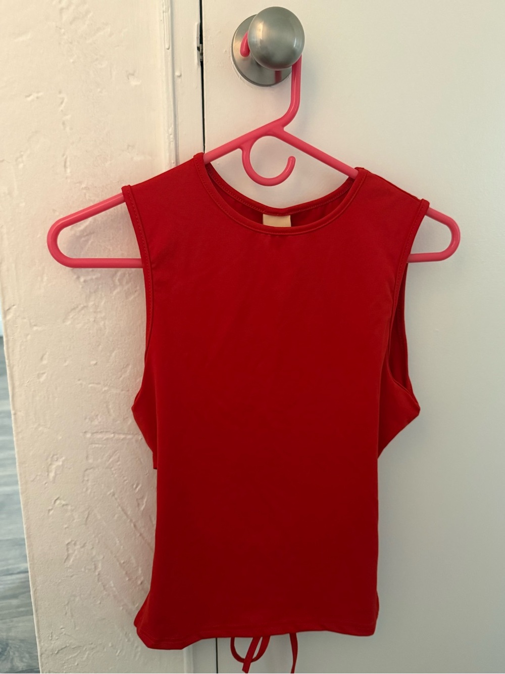 (2) Tank tops, red and brown, with open back and tie closure.